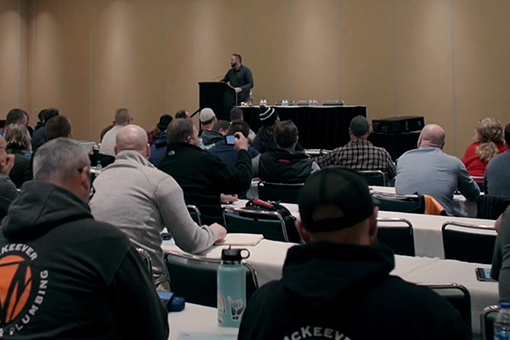 Attendees of Plumbing Conference with a Professional Speaker