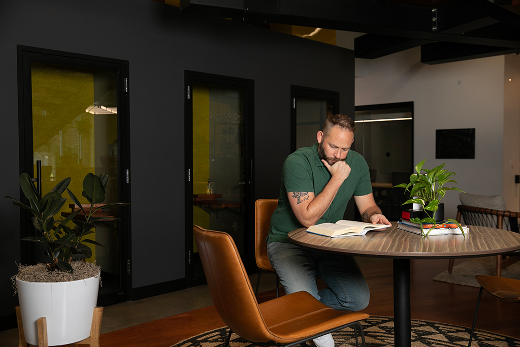 Plumbing Business Owner Reading a Book About To Increase Value of Company